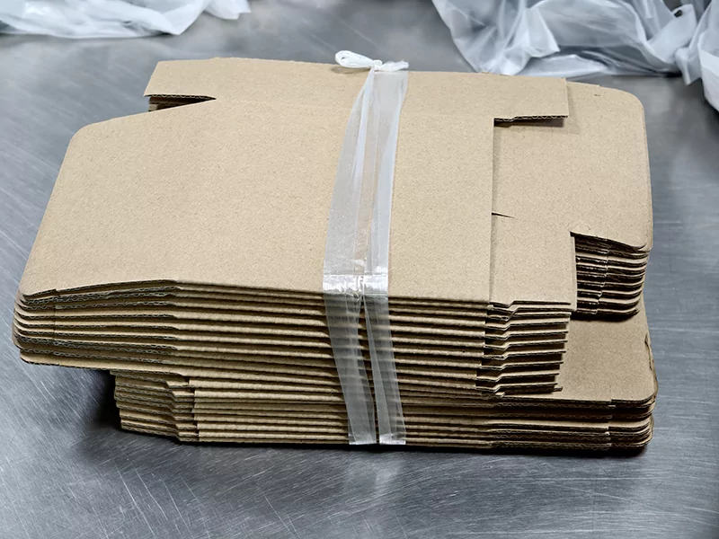 The picture shows a bundle of cardboard packaging